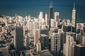 aerial view photography of city buildings near body of water