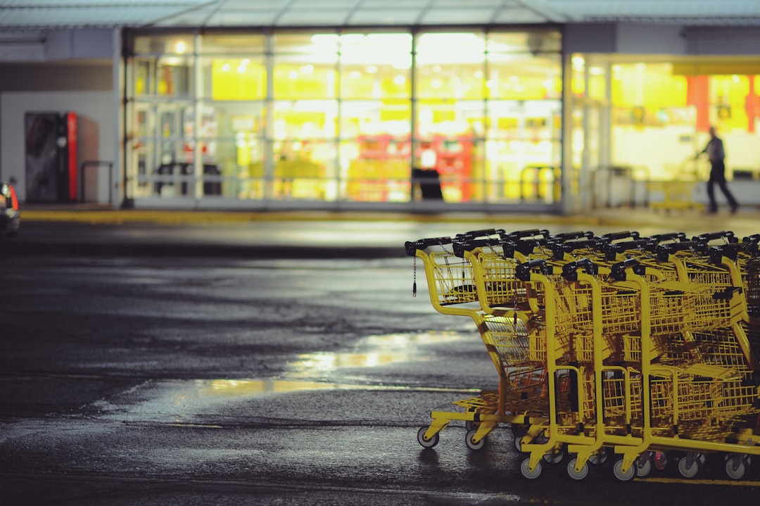 Yellow shopping carts stacked on a parking lot