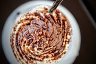 Close-up of rich chocolate gelato with a smooth texture, emphasizing natural ingredients.