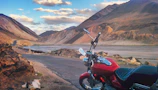 A scenic view of San José del Guaviare with a motocross trail winding through the landscape.