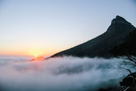 A scenic mountain landscape during sunrise.