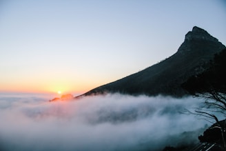 A scenic mountain landscape during sunrise.