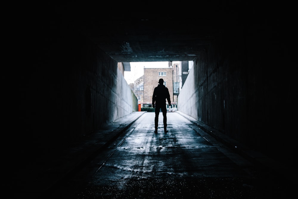 silhouette of man in underground garage