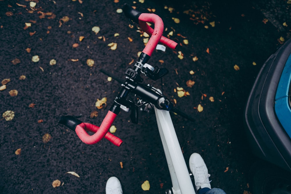 photo of red and gray bicycle