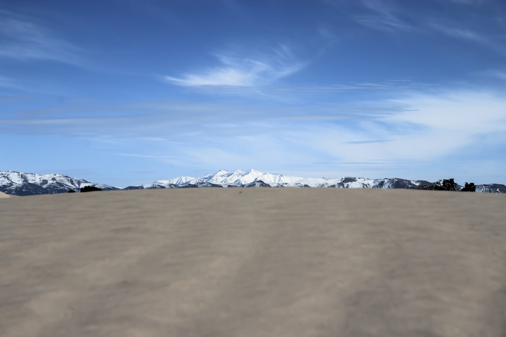 white clouds over snow covered field during daytime