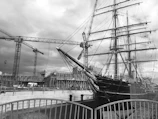 Wide shot of the shipyard with the zeilvracht 1893 mid-restoration surrounded by scaffolding.