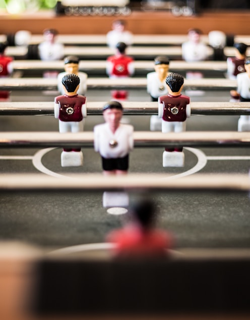 brown foosball table closeup photography