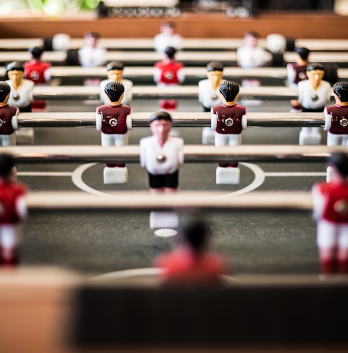 brown foosball table closeup photography