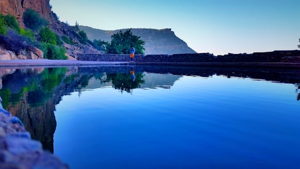 A serene scene of a person enjoying a peaceful morning walk in nature, symbolizing balance and well-being.
