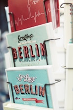 shallow focus photography of greeting cards on rack