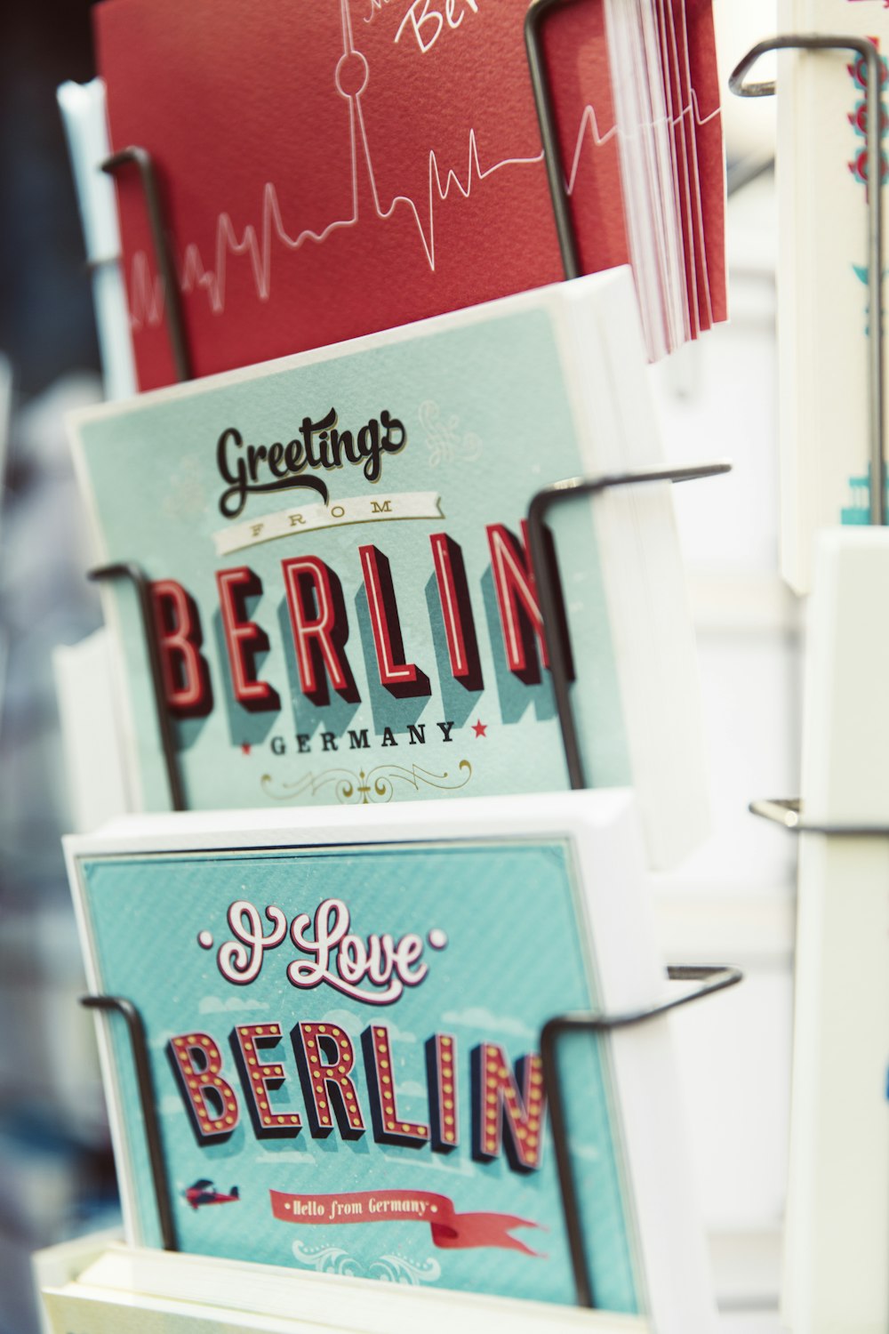 shallow focus photography of greeting cards on rack