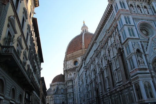 white domed concrete tower near building at daytime in Florence Cathedral Italy