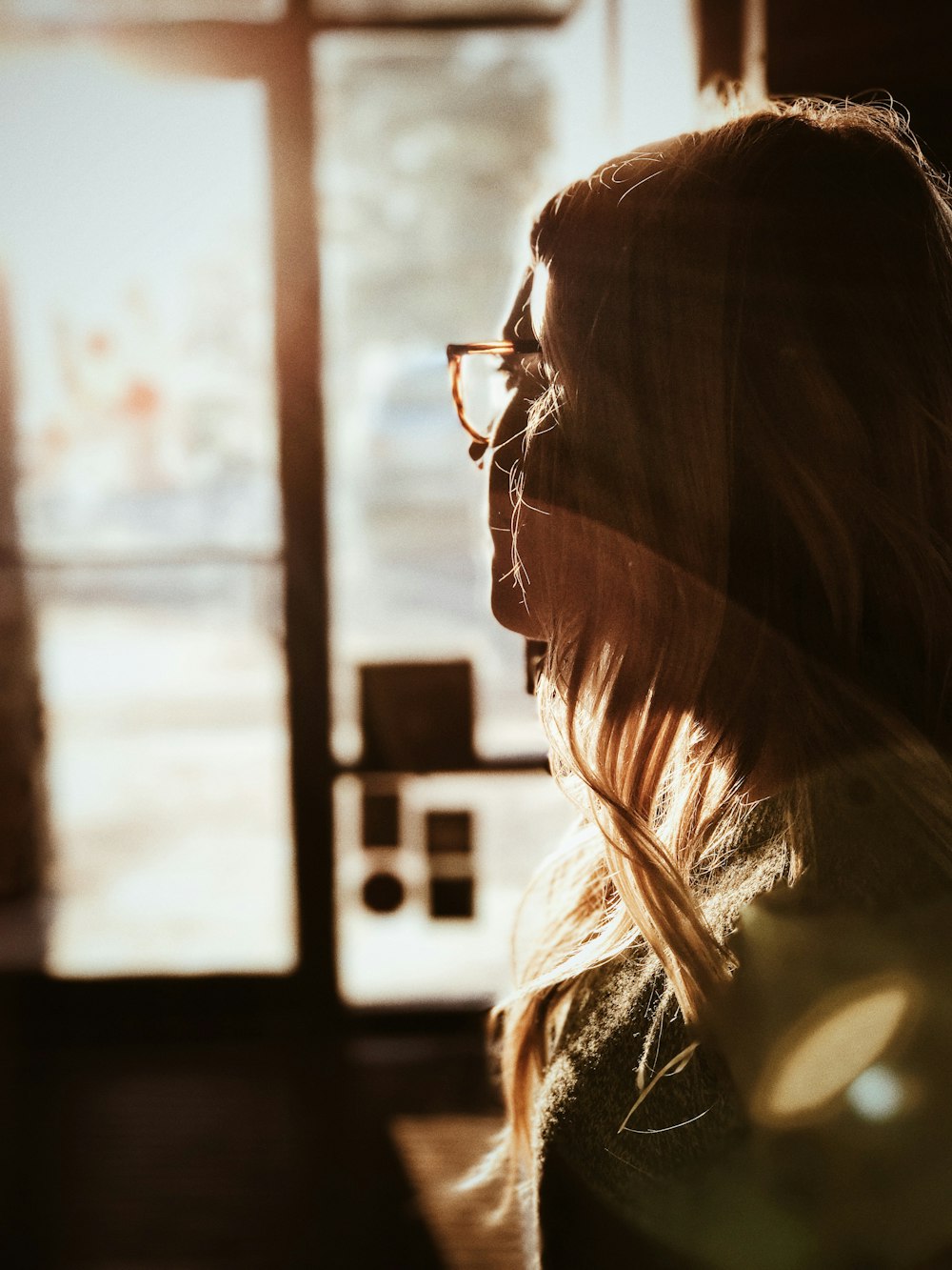 shallow focus photography of woman facing door