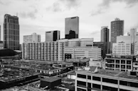 A city skyline with diverse commercial buildings representing portfolio assets.