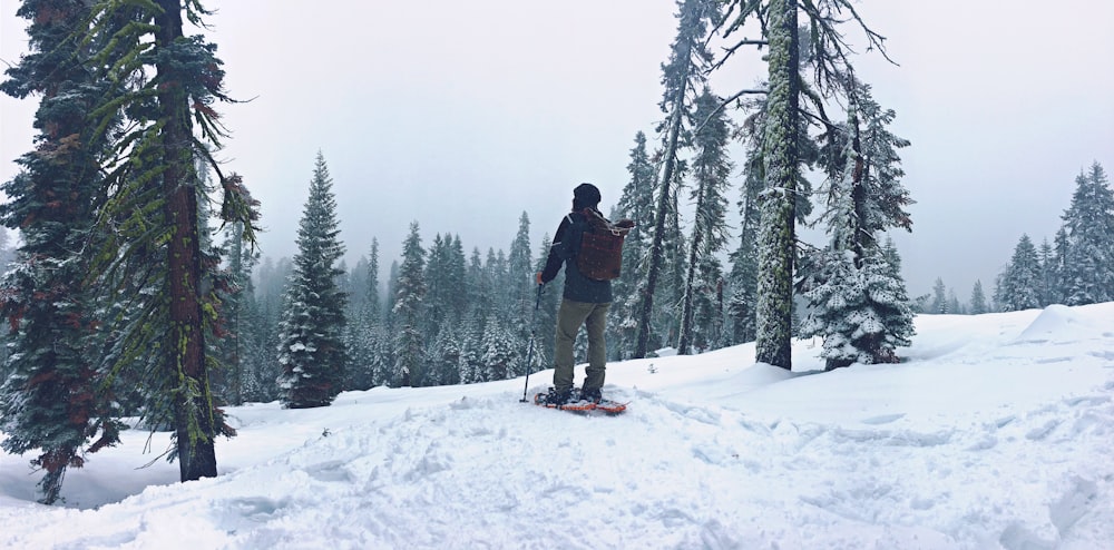 man riding on snowboard