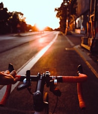 person riding on bicycle on road