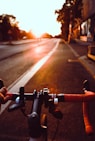 person riding on bicycle on road