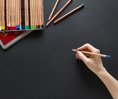 person holding brown pencil