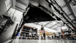 A panoramic view of a modern boxing training facility.