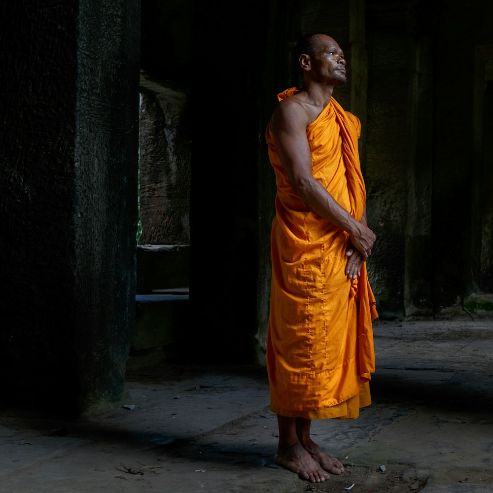 man standing on dimmed area