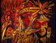 A vivid and energetic painting featuring abstract indigenous faces adorned with vibrant headgear and ornaments. The composition is filled with swirling patterns and symbols, predominantly in warm shades of red, orange, and yellow. The brushstrokes are dynamic, suggesting movement and intensity.