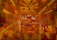 A geometric and abstract painting featuring the stylized face of an ancient Egyptian pharaoh. The composition uses bold lines and angular shapes, predominantly in shades of brown, red, and gold. The pharaoh's eyes are emphasized with contrasting blue and framed by patterned elements that suggest traditional Egyptian headdress details. The sun is represented with radiant beams emanating from the top.