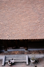 A friendly customer service representative ready to assist with roof tile inquiries.