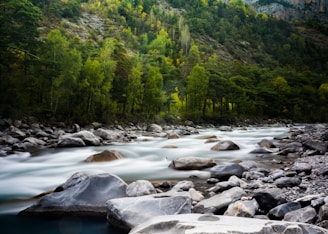 timelapse photograph of rocky river