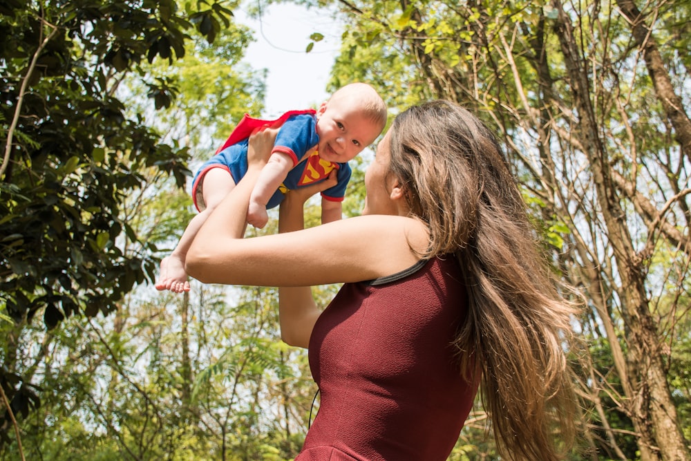 woman carrying baby