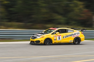 yellow Honda Civic riding on road