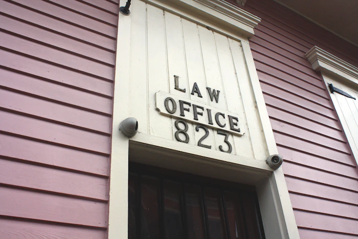 Law office plaque on a painted wooden wall