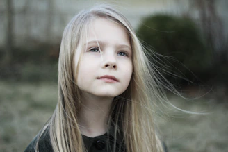 close-up photography of girl in black top during daytime