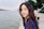 woman standing near body of water