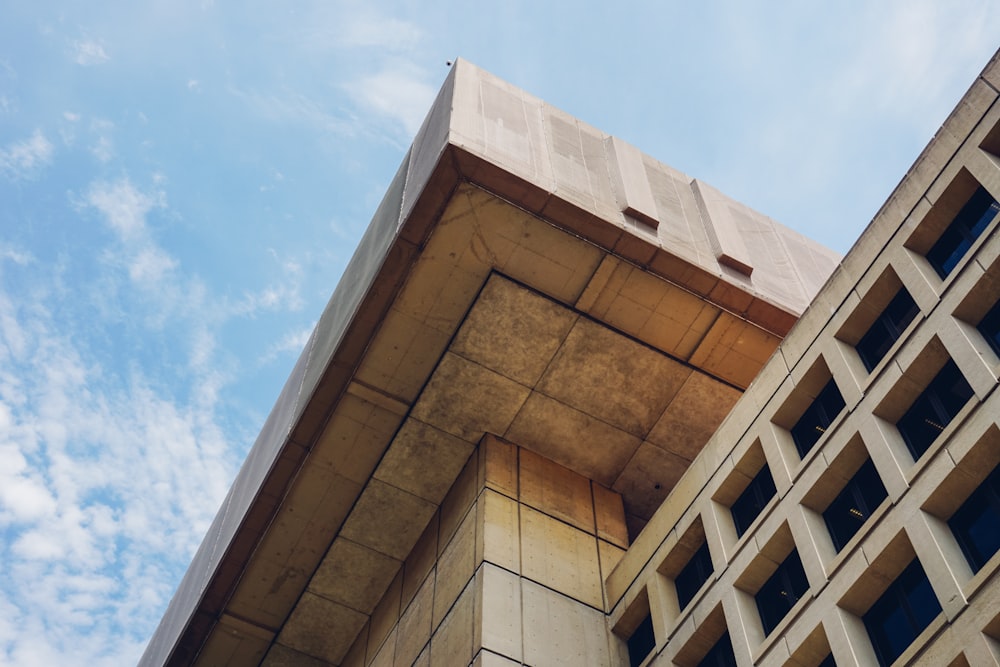 brown concrete building under blue sky during daytime