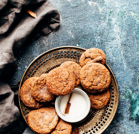 platter of cookies on top of blue surface