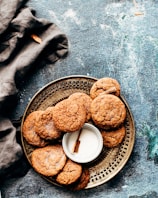 platter of cookies on top of blue surface