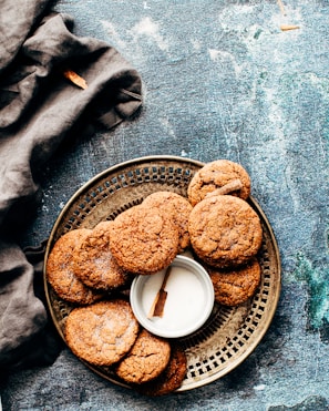 platter of cookies on top of blue surface