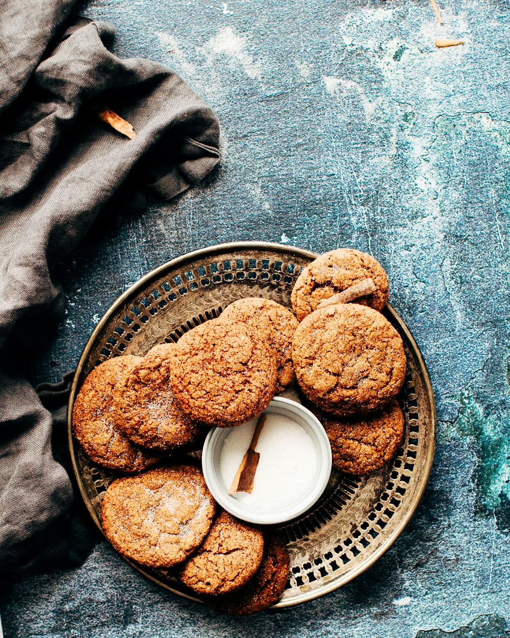 platter of cookies on top of blue surface