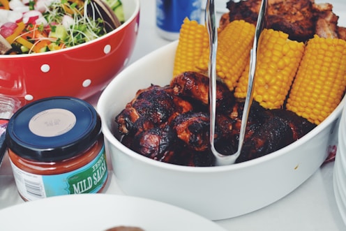 grilled food and corn cob on oval pan