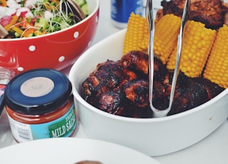 grilled food and corn cob on oval pan