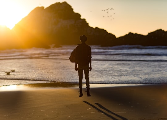 silhouette of man floating in air in Seal Rocks United States