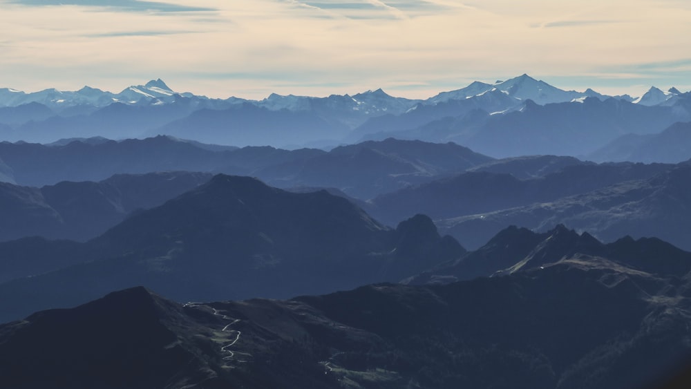 black and white mountains under white sky during daytime