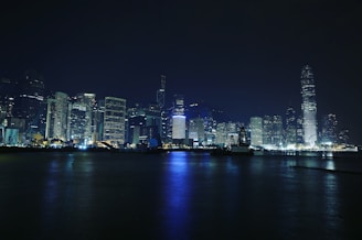 A vibrant city skyline at night with sparkling lights.