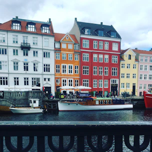 Scenic view of Aveiro canals with colorful boats and charming architecture.