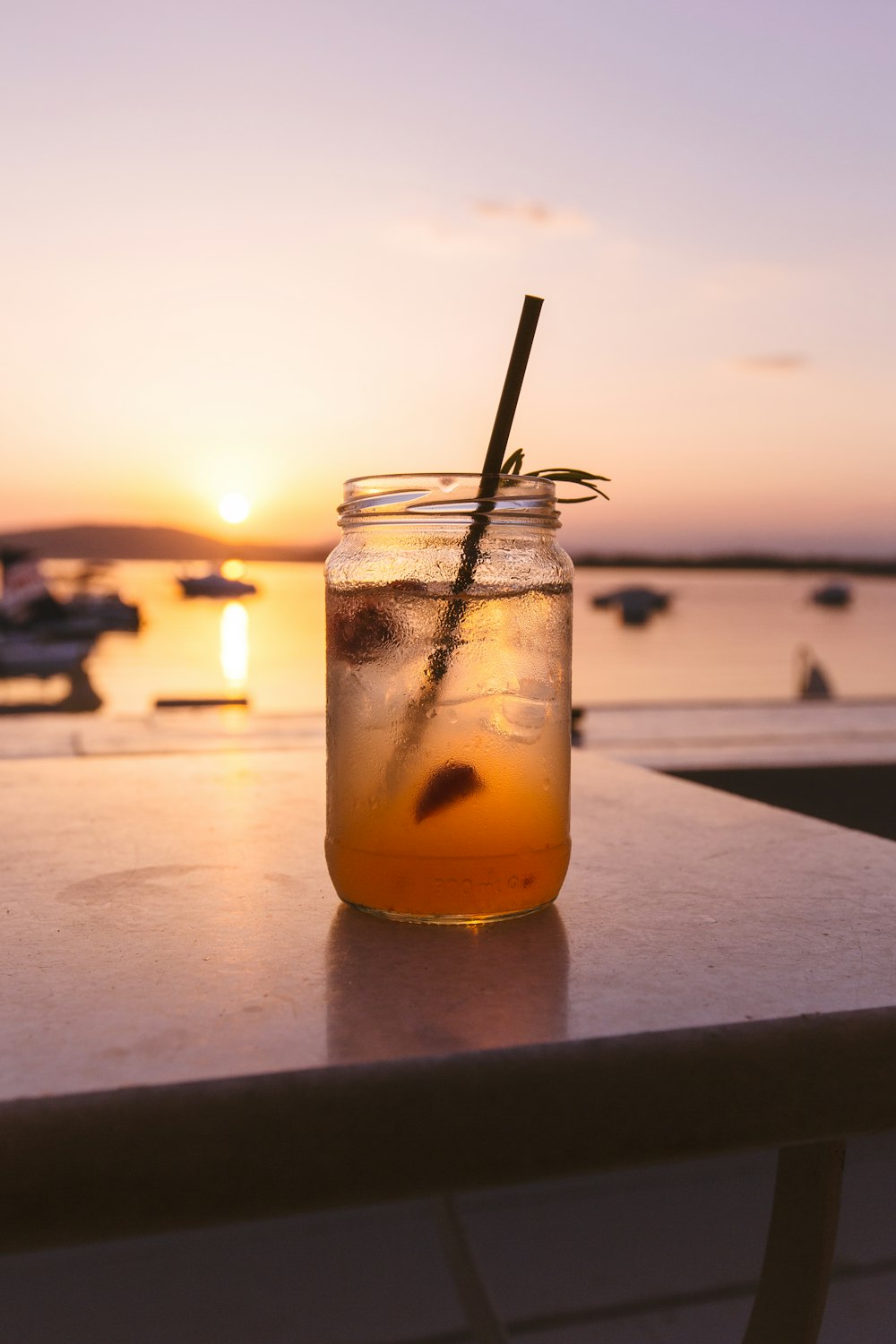 clear glass mason jar filled with juice