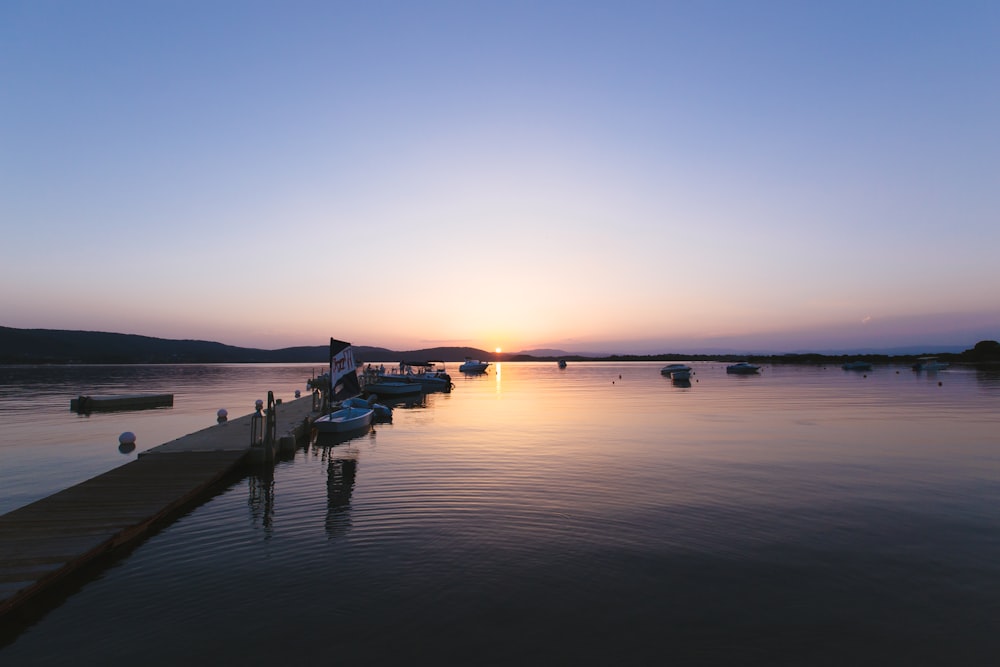 a group of boats that are sitting in the water