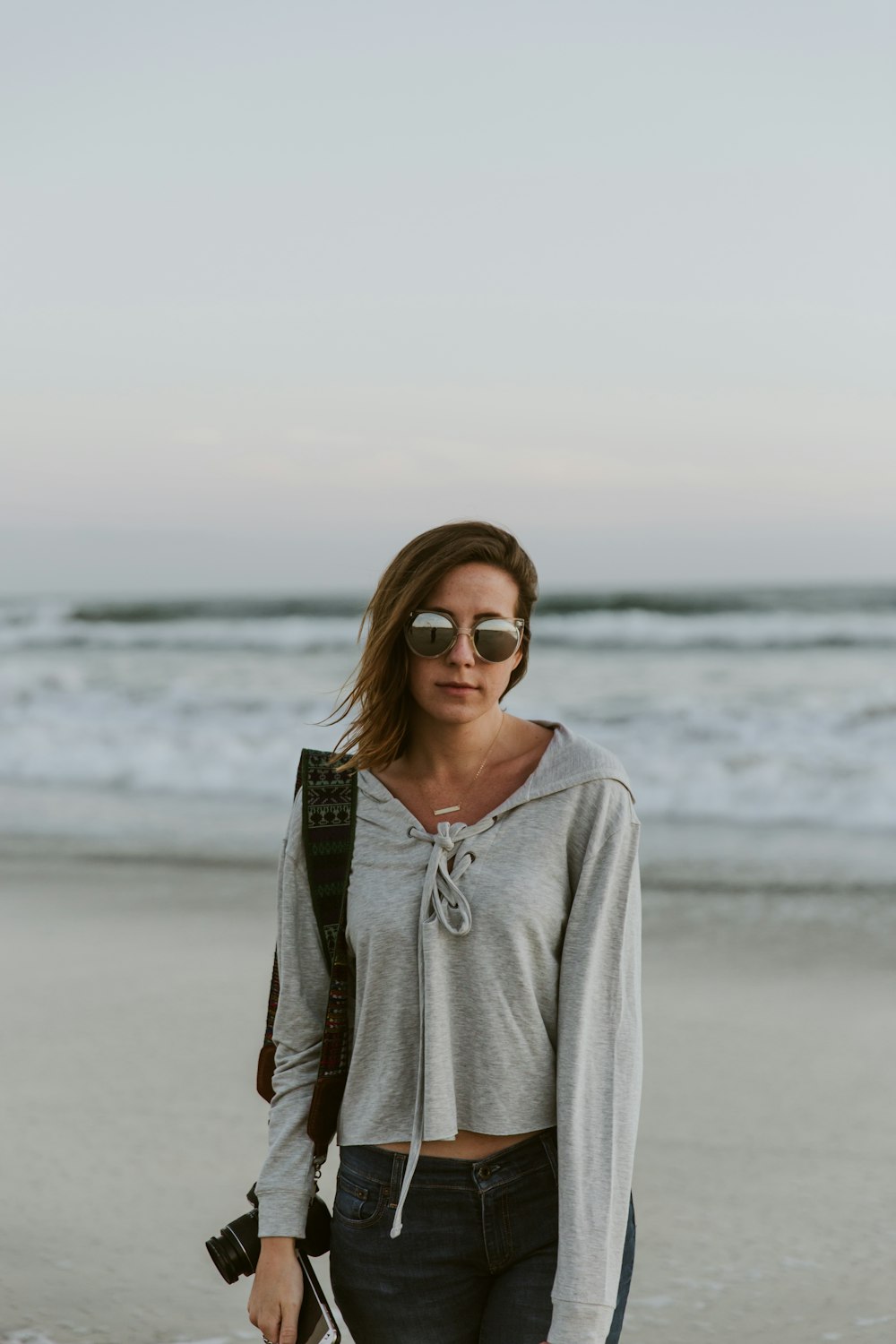 woman standing near body of water