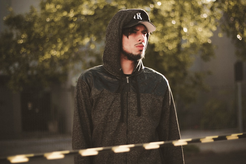 man in black zip-up hoodie