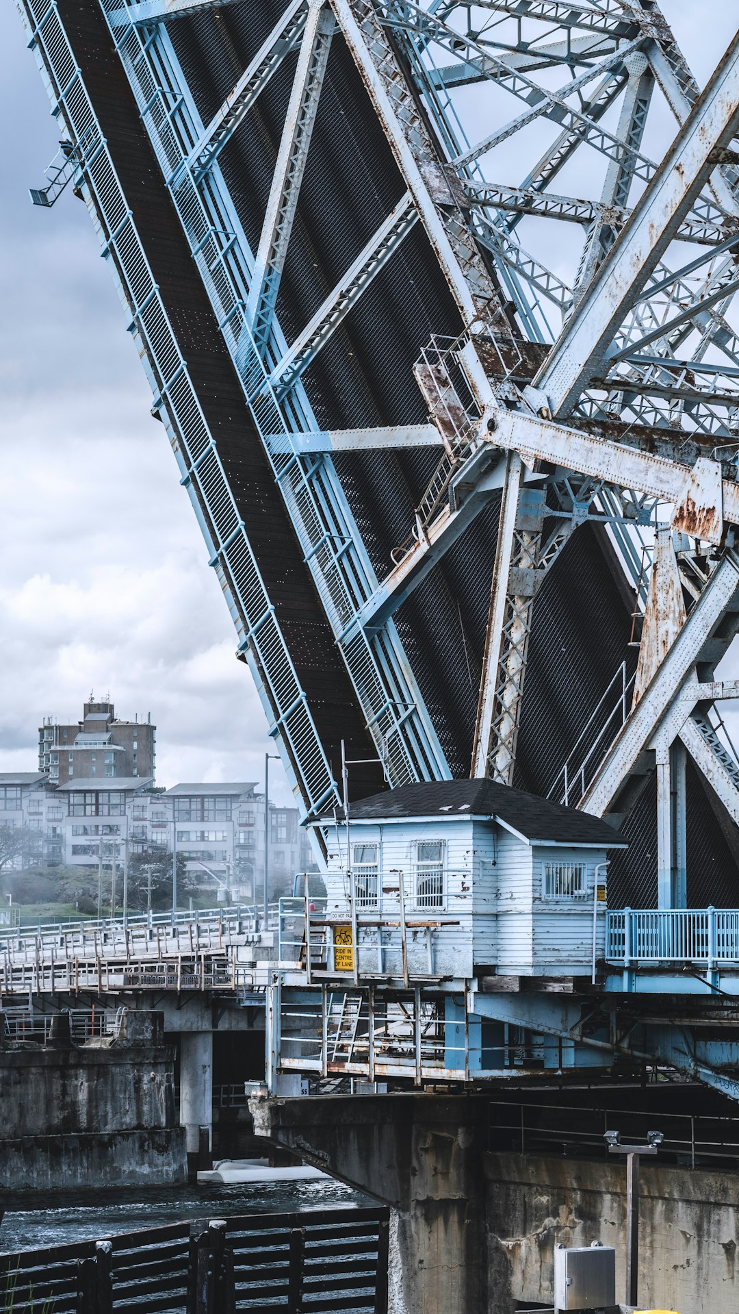 black, white, and black bascule bridge under white skies