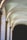 Elegant arches with soft natural lighting create a serene and timeless atmosphere. The stone structure features smooth, curved lines that enhance the architectural beauty of the space.